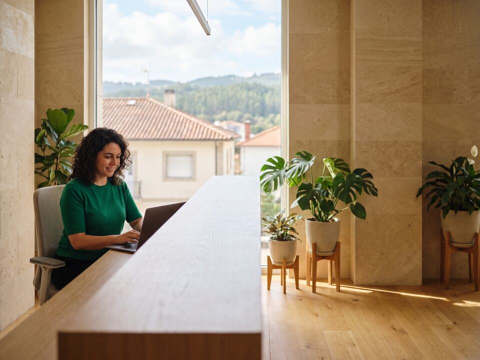 A receptionist working at a clinic front desk in Tbilisi